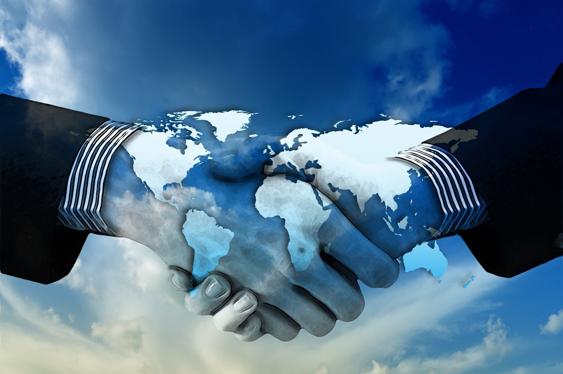 Two hands shaking in agreement, symbolizing the new cooperation between Actemium NDS and ScanMaster in providing advanced ultrasonic inspection solutions.